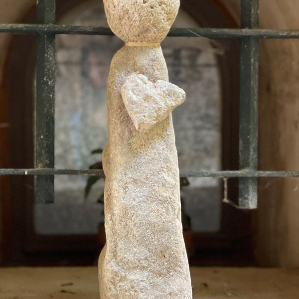 romantic stone statue with heart