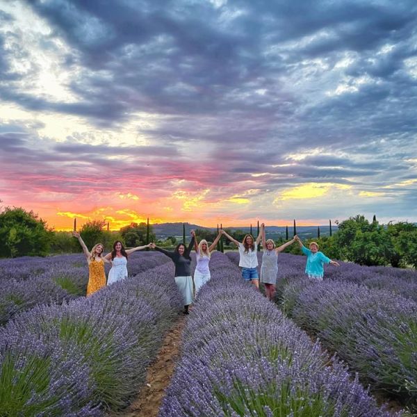 happy small group of women on lavender photography tour in French lavender field at sunset