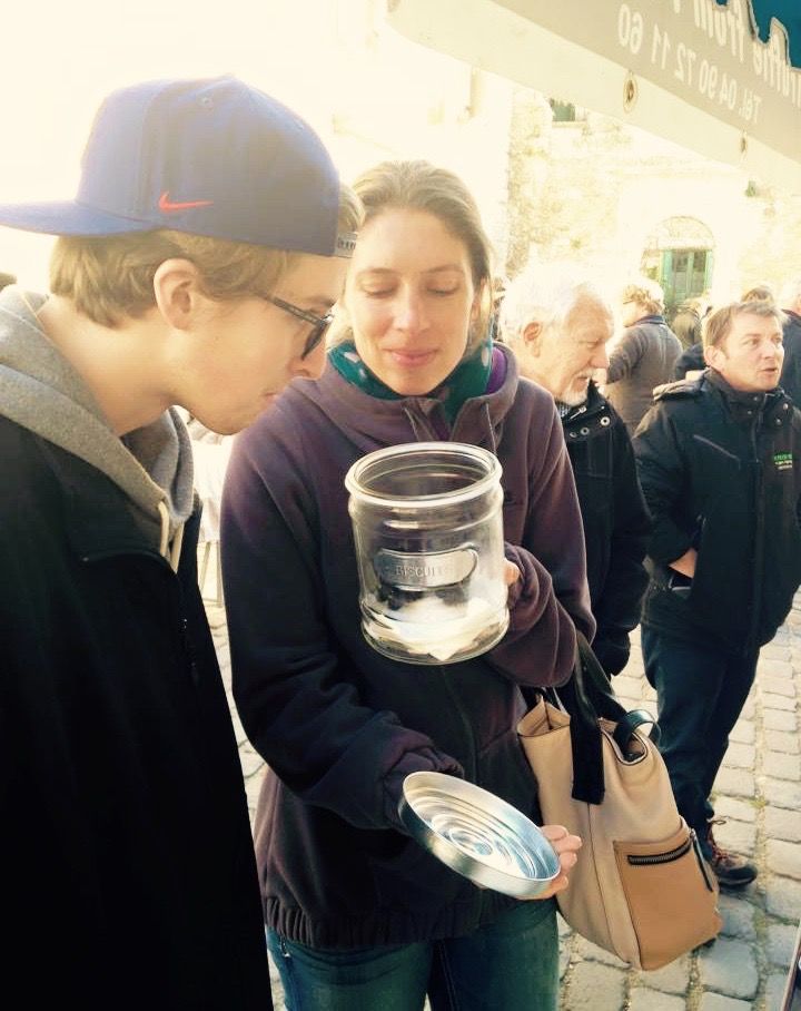 smelling fresh truffles in a jar on Provence truffle and wine tour