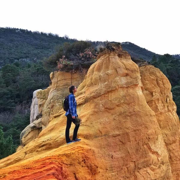 tour guide Emily Durand on hiking tour in ochre hills Roussillon region of France