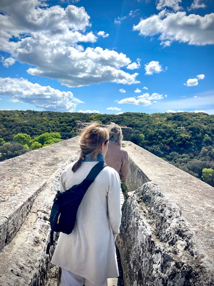walking on the Pont du Gard Roman aqueduct in Provence, France