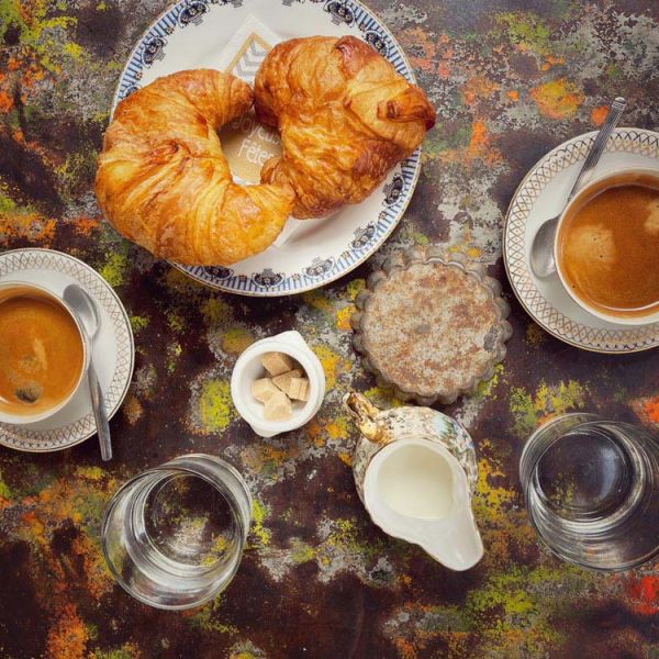 Provencal breakfast of fresh croissants and coffee