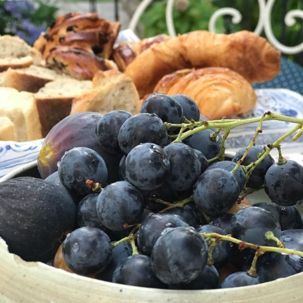 breakfast of French pastries, local fresh fruit and coffee