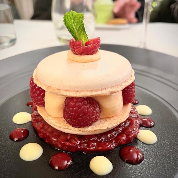 dessert with macarons and raspberries