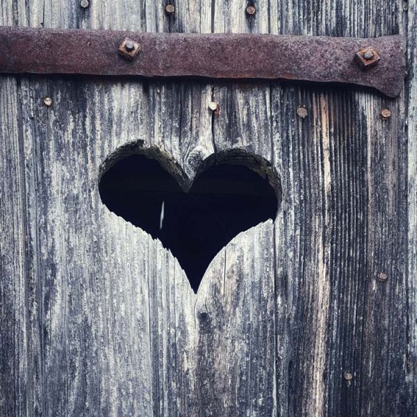 heart carved in old wood door